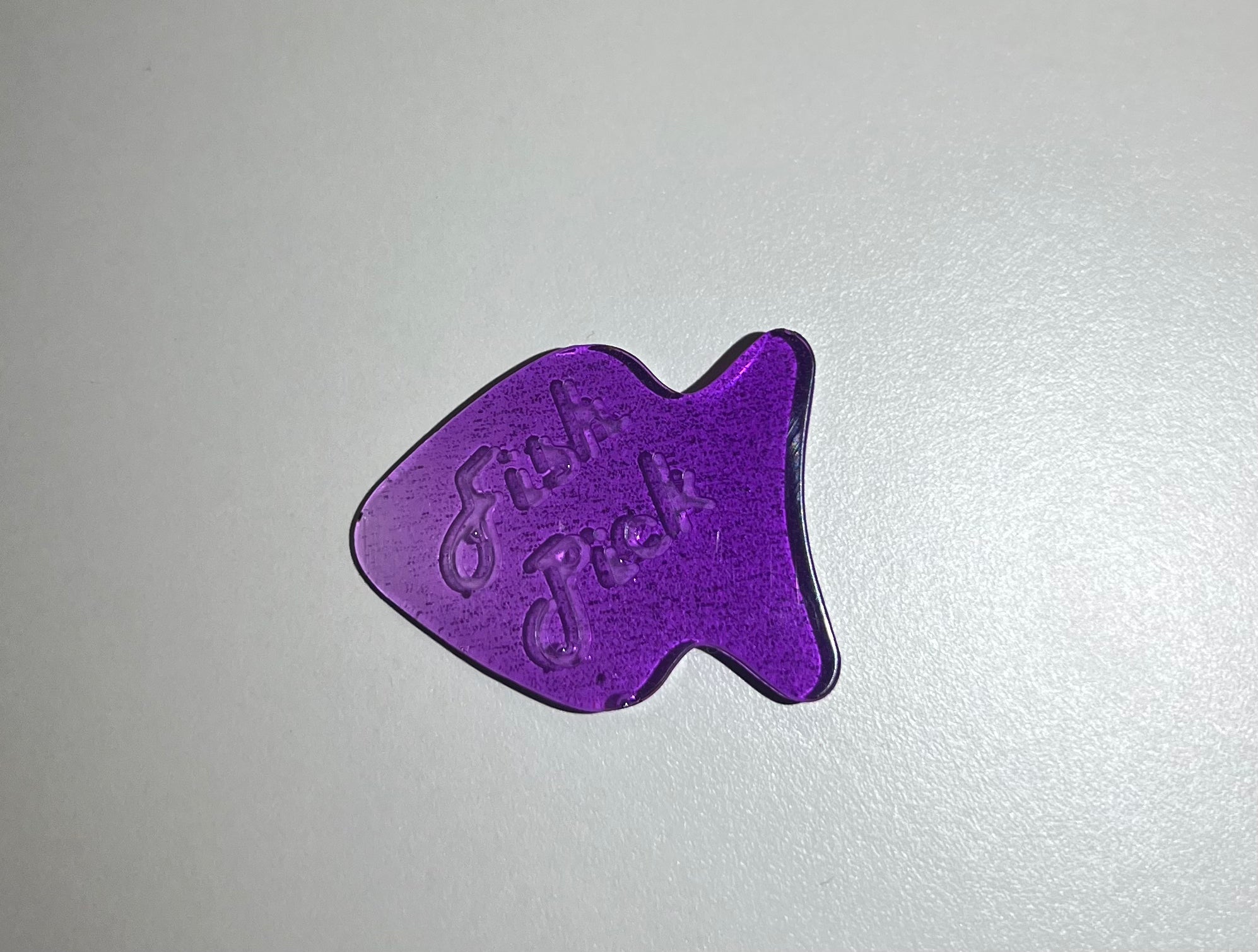 Púa “fish pick”